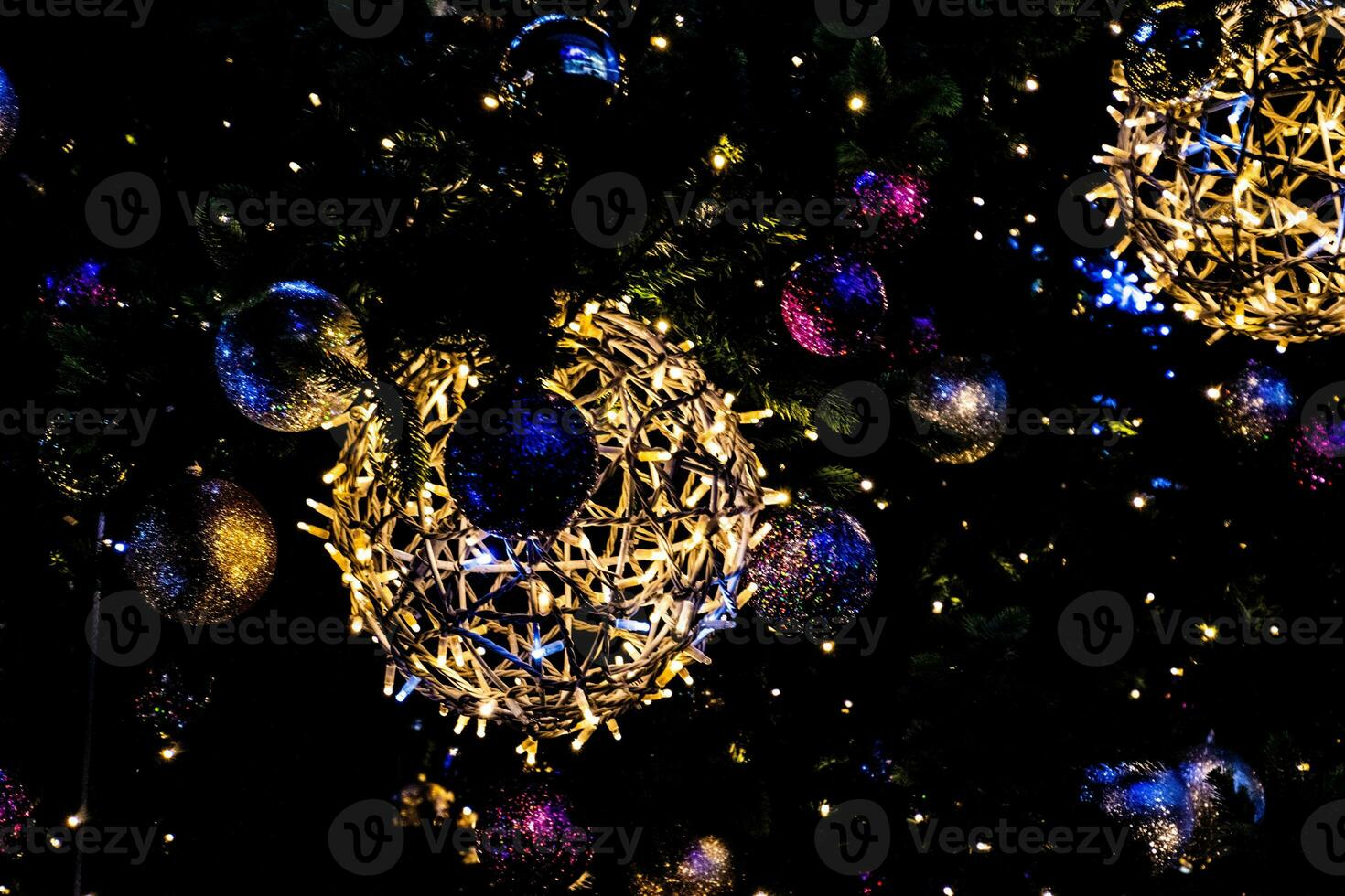 Christmas decorations with lights on a black background outside photo