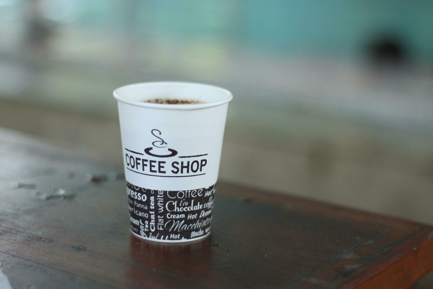 black coffee in a paper cup. photo