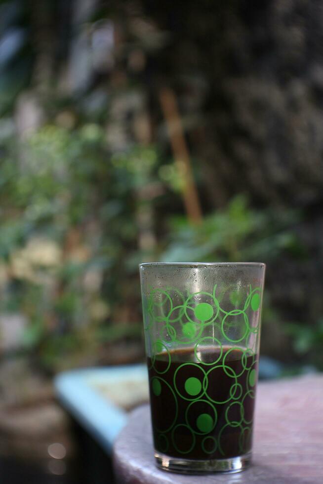 black coffee with transparent glass cup. photo