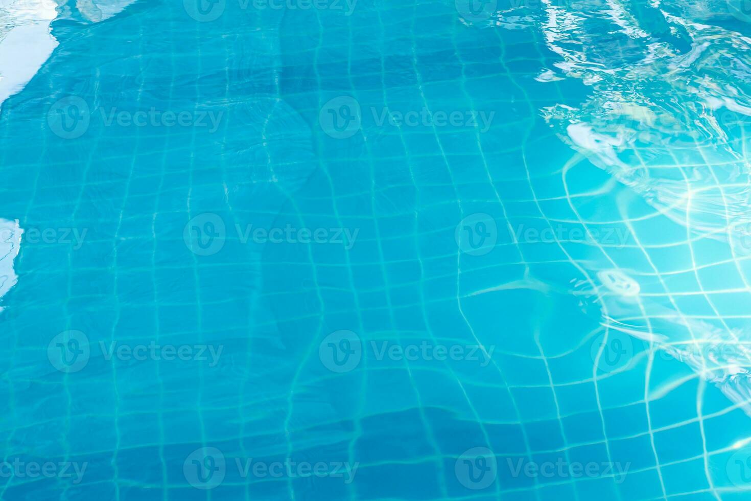 surface of blue swimming pool background. Abstract beautiful ripple wave water in swimming pool. photo