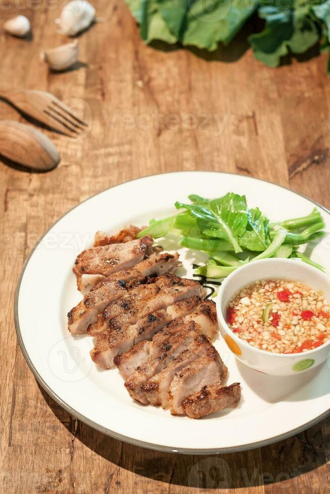 Grilled pork with chili sauce photo