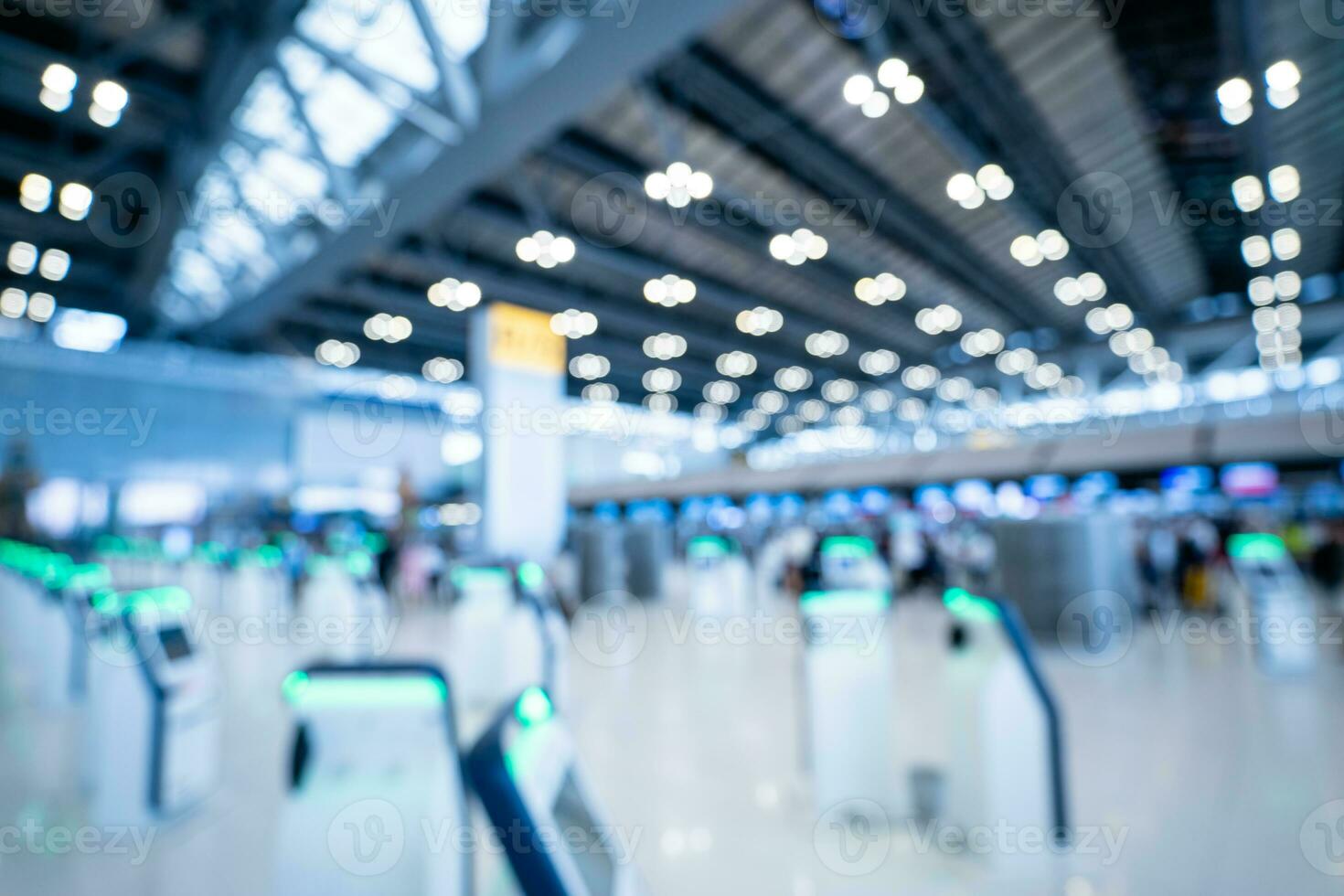 Blurred images of Self-service check-in machine at Check-in counters at Suvarnabhumi International Airport photo