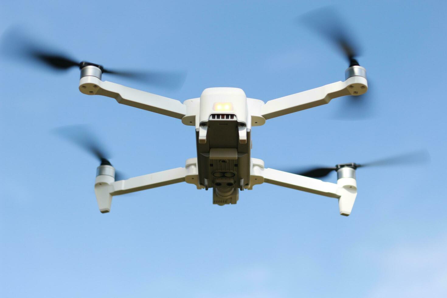 Bogor, Indonesia - 2022. a photo of a drone flying with a blurry propeller against a blue sky background. technology photo concept.