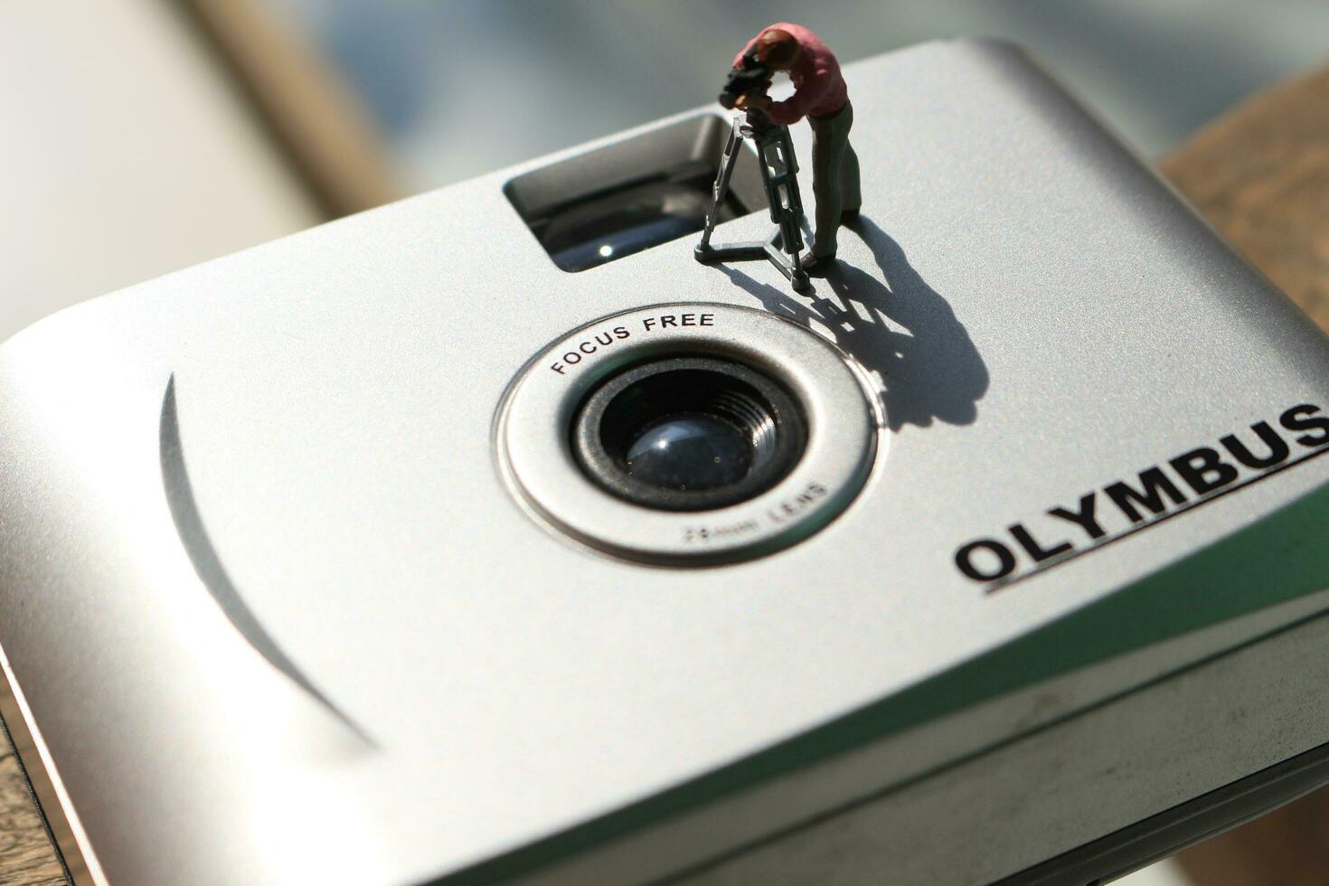 Bogor, Indonesia - 2018. miniature figure of a videographer recording on an analog camera. photo