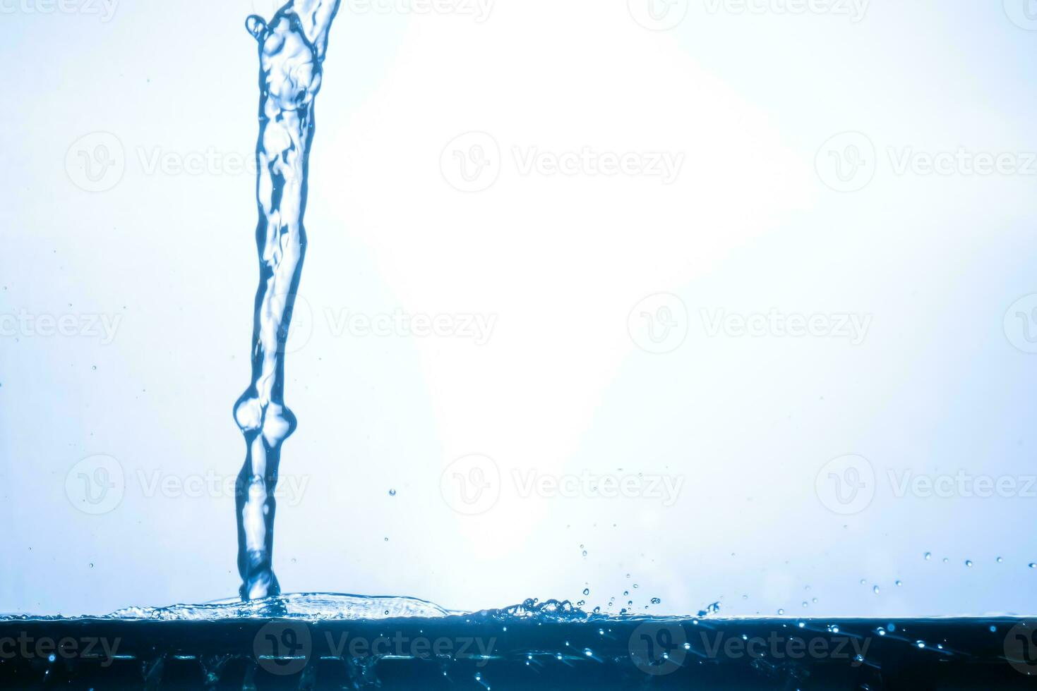 splashing water droplets on a white background photo