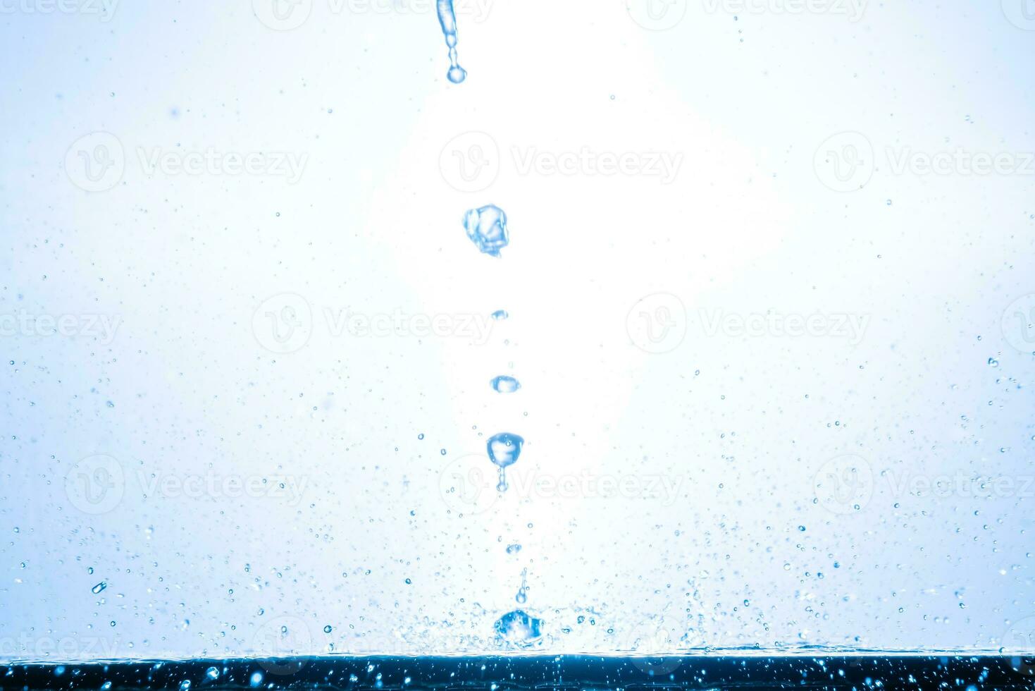 splashing water droplets on a white background photo