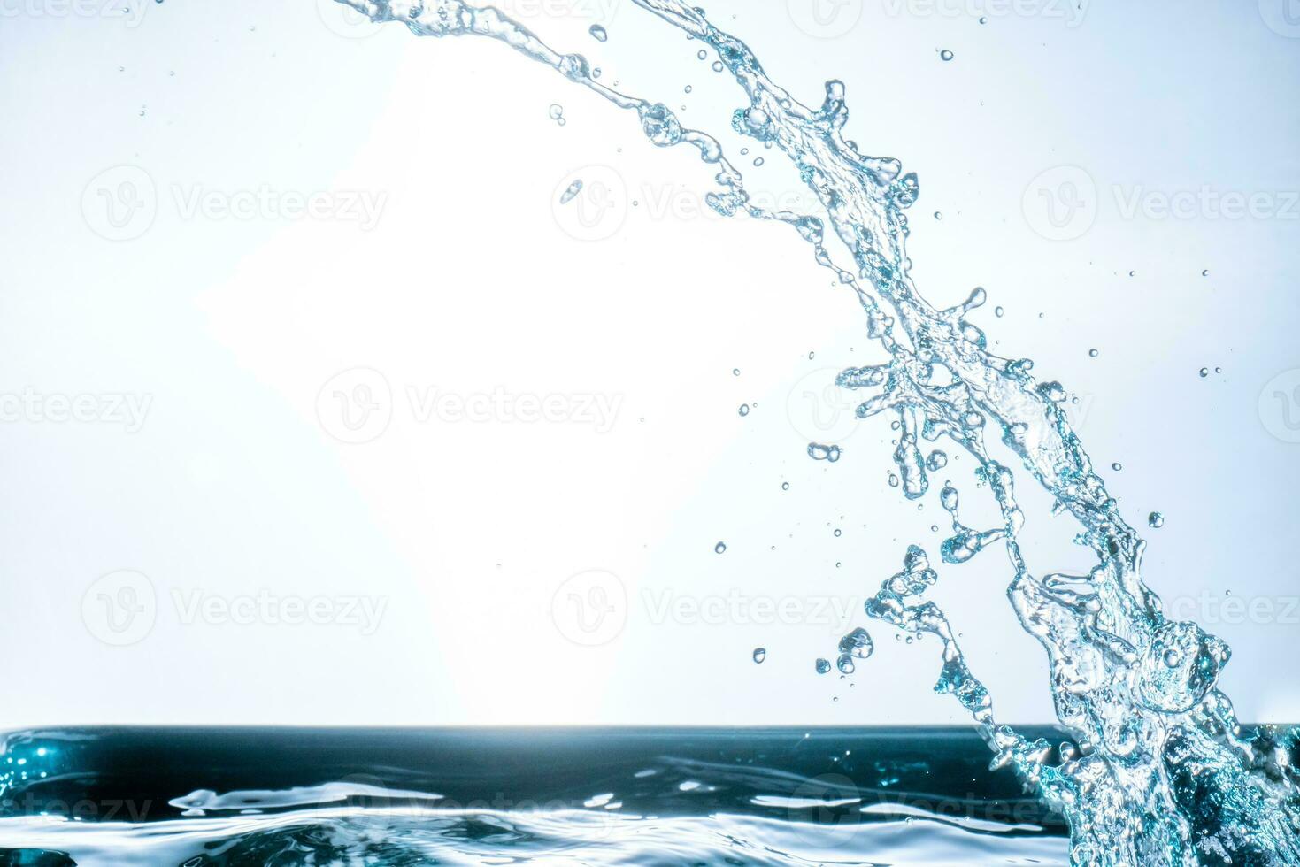 splashing water droplets on a white background photo