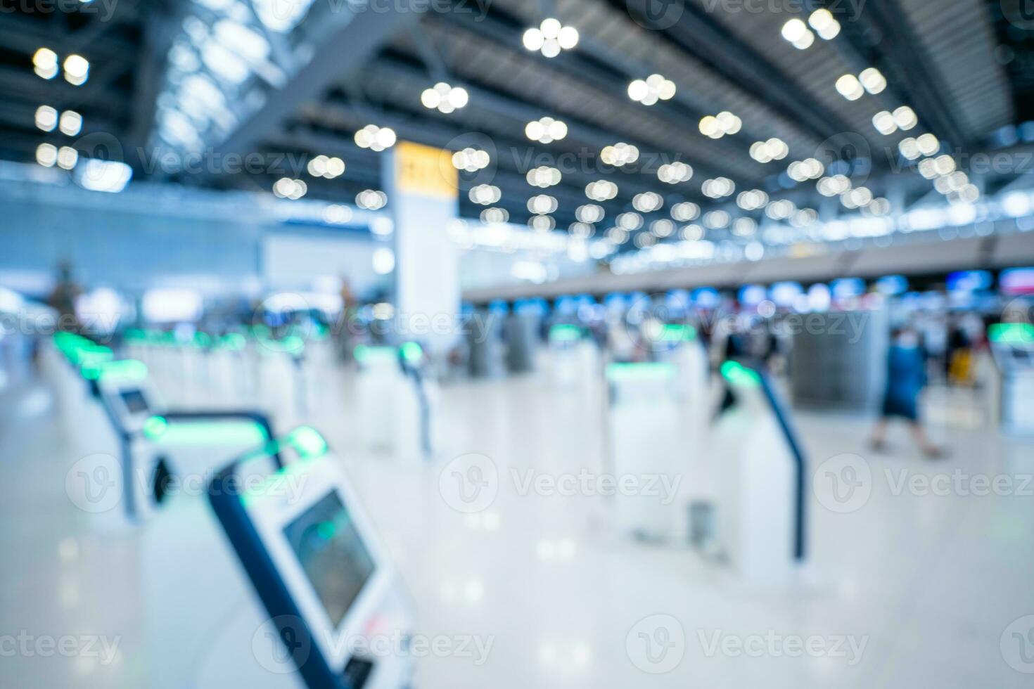 Blurred images of Self-service check-in machine at Check-in counters at Suvarnabhumi International Airport photo