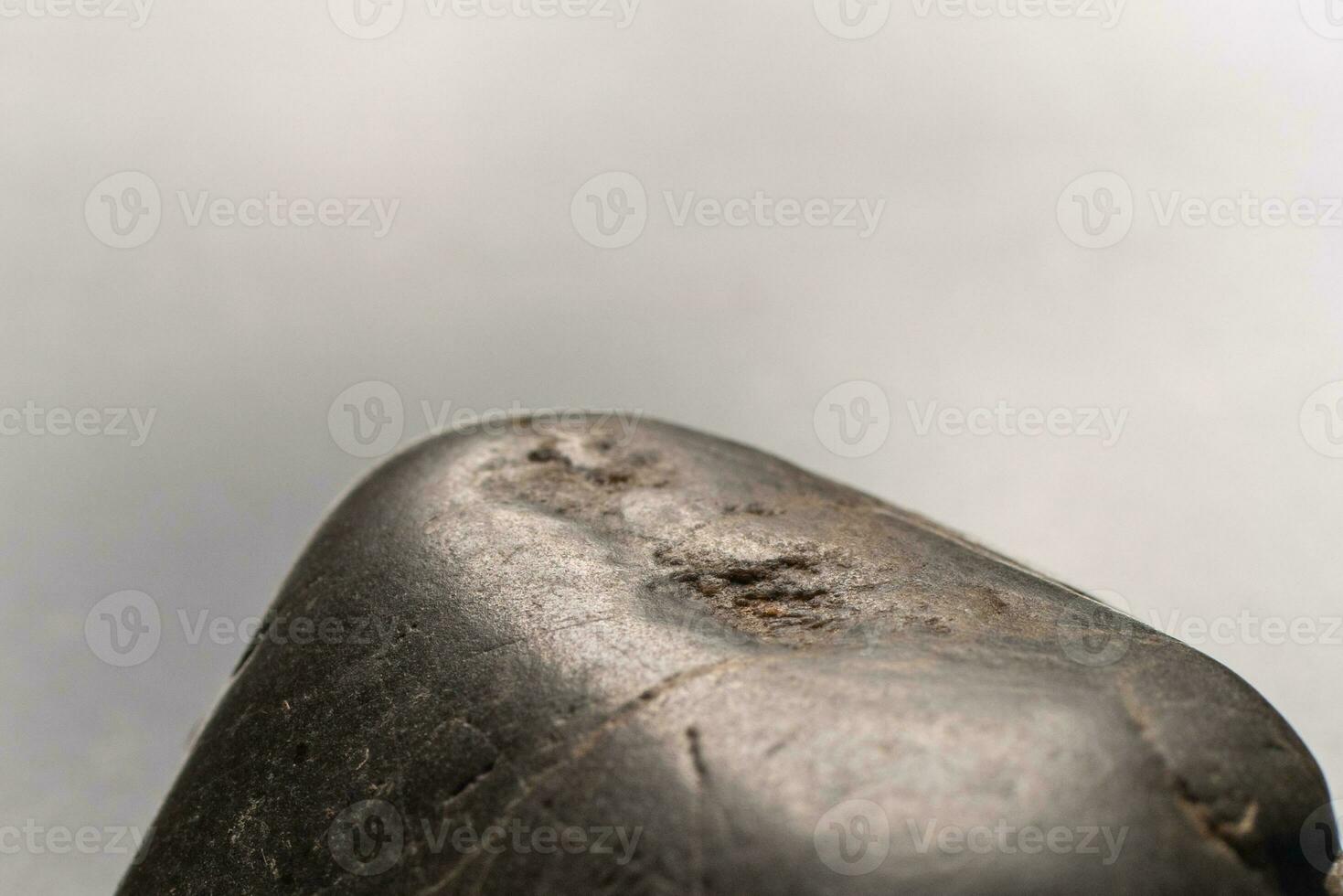 holes of the black rock surface,  selective focus, and soft focus. photo