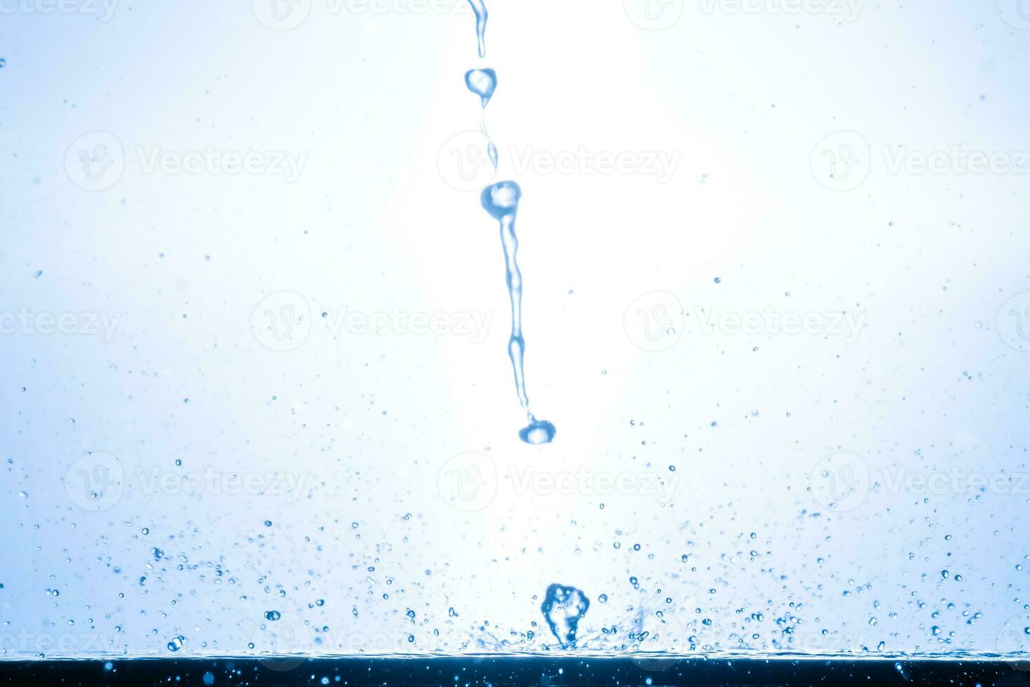 splashing water droplets on a white background photo