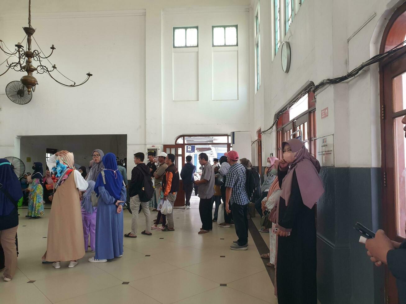 Tegal, May 2023. The atmosphere at Tegal train station was full of people queuing to check their tickets to get into the train carriages in the morning. photo
