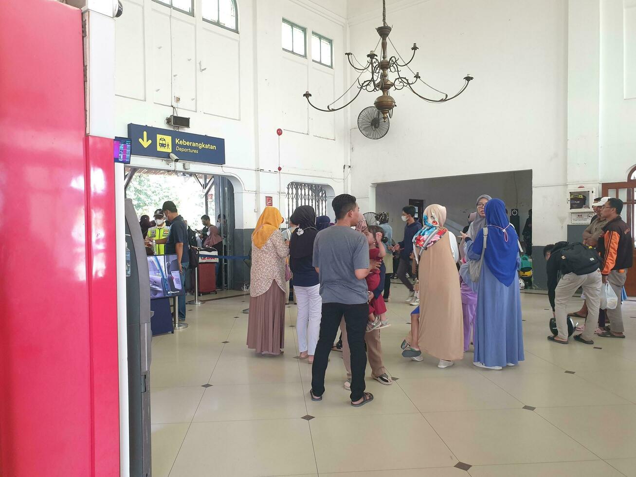 Tegal, May 2023. The atmosphere at Tegal train station was full of people queuing to check their tickets to get into the train carriages in the morning. photo