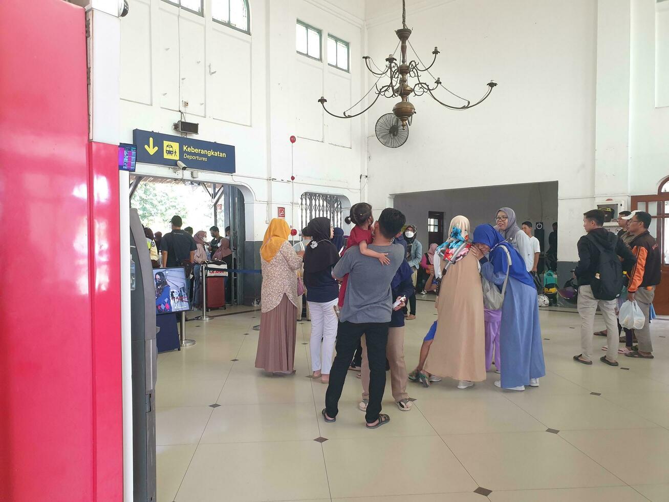 Tegal, May 2023. The atmosphere at Tegal train station was full of people queuing to check their tickets to get into the train carriages in the morning. photo
