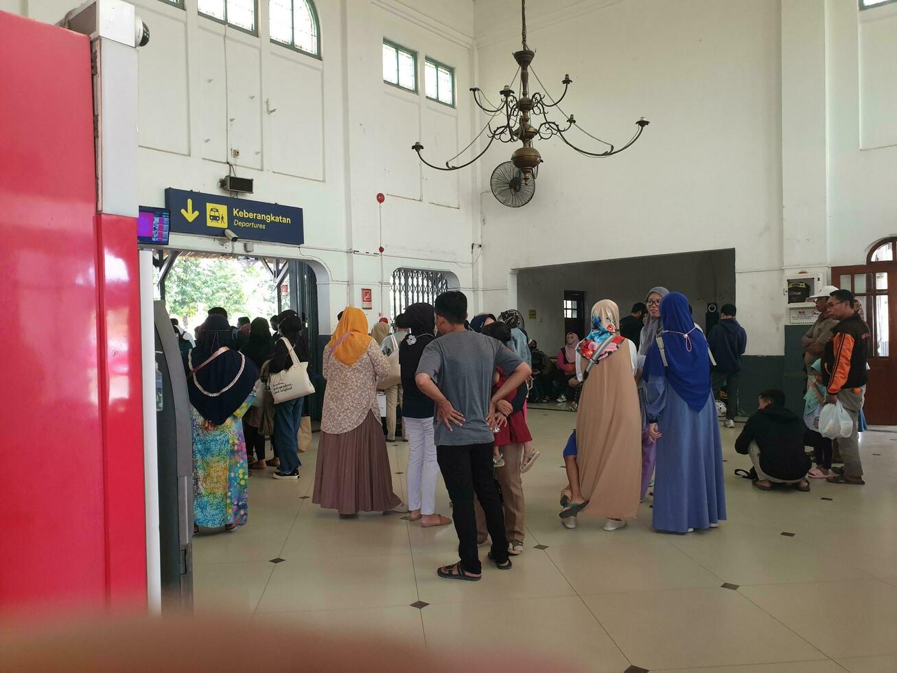 Tegal, May 2023. The atmosphere at Tegal train station was full of people queuing to check their tickets to get into the train carriages in the morning. photo