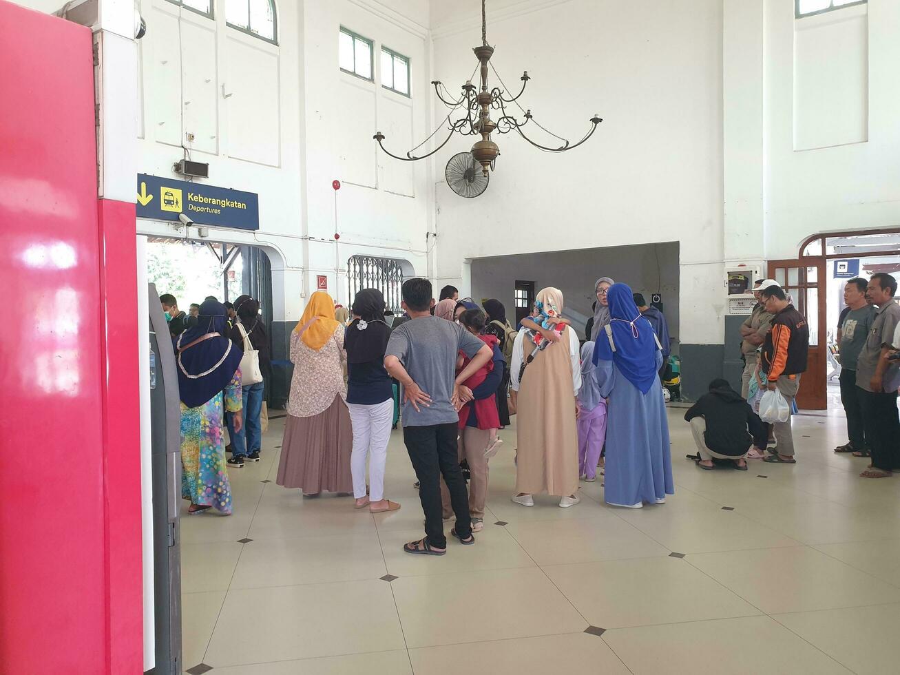 Tegal, May 2023. The atmosphere at Tegal train station was full of people queuing to check their tickets to get into the train carriages in the morning. photo