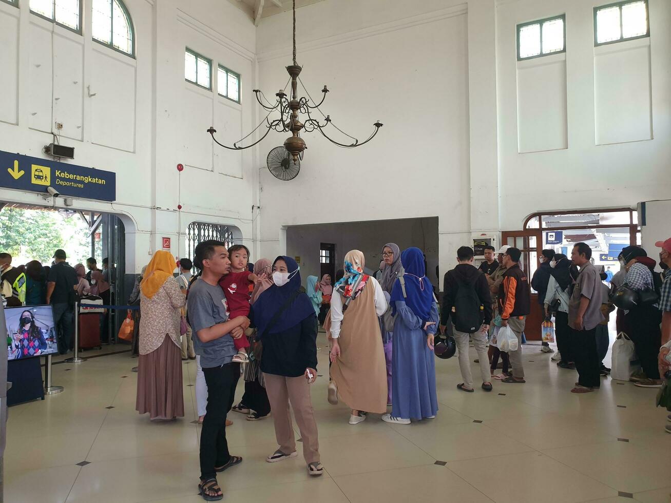 Tegal, May 2023. The atmosphere at Tegal train station was full of people queuing to check their tickets to get into the train carriages in the morning. photo