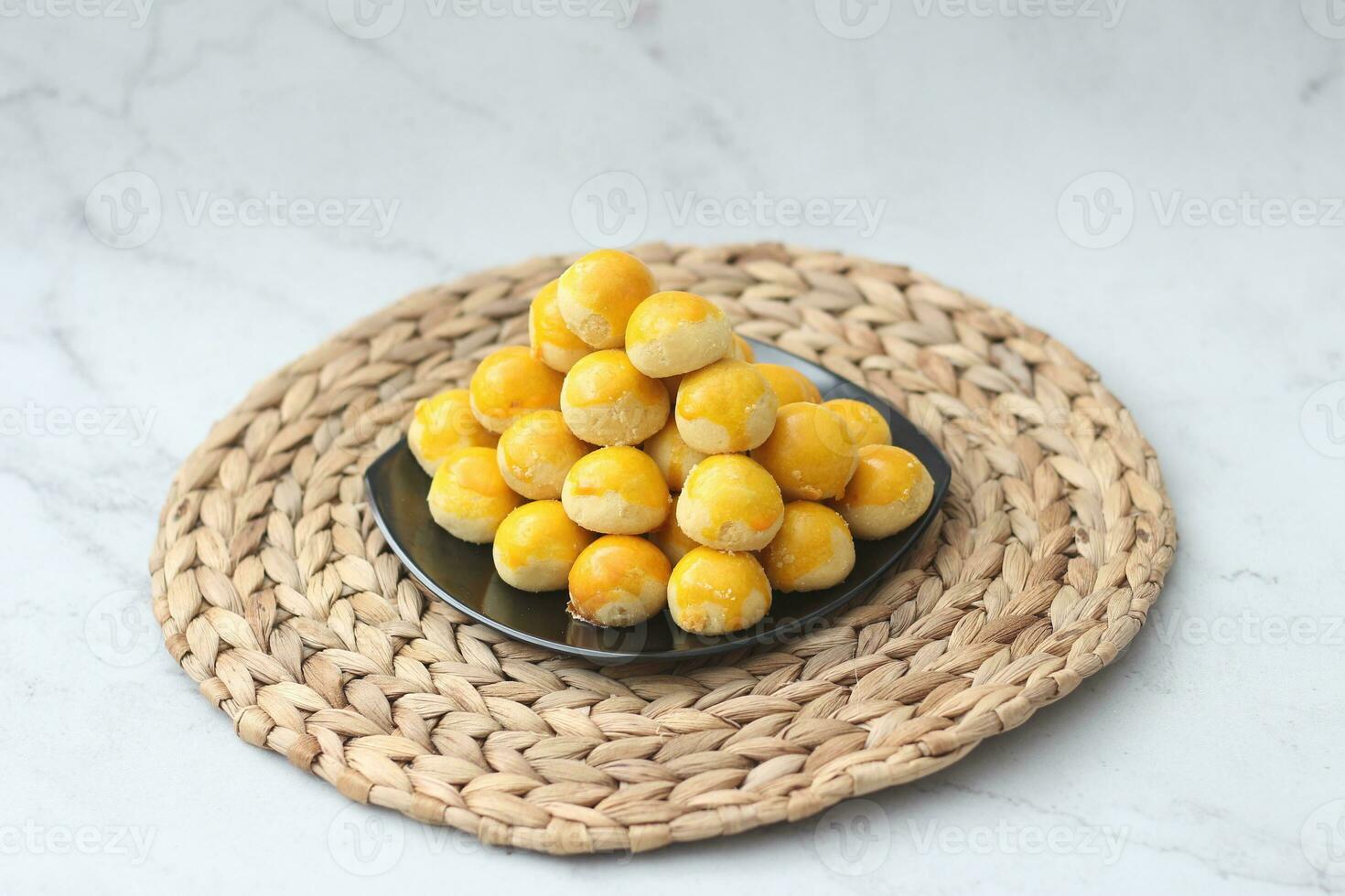 nastar cookies, pineapple tarts or nanas tart are small, bite-size pastries photo