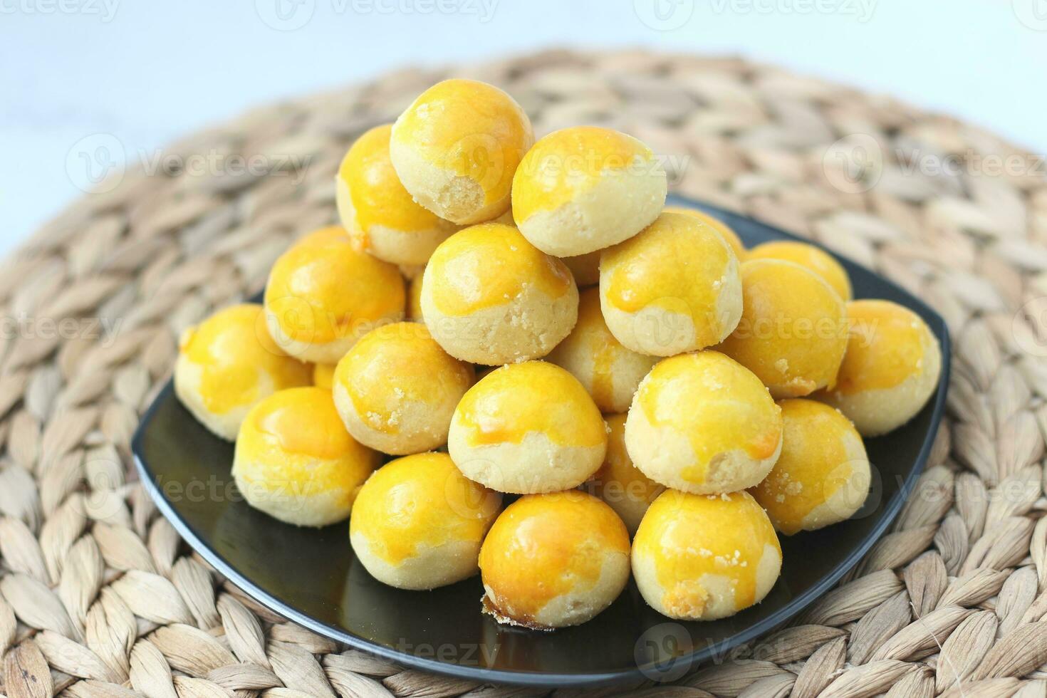 nastar cookies, pineapple tarts or nanas tart are small, bite-size pastries photo