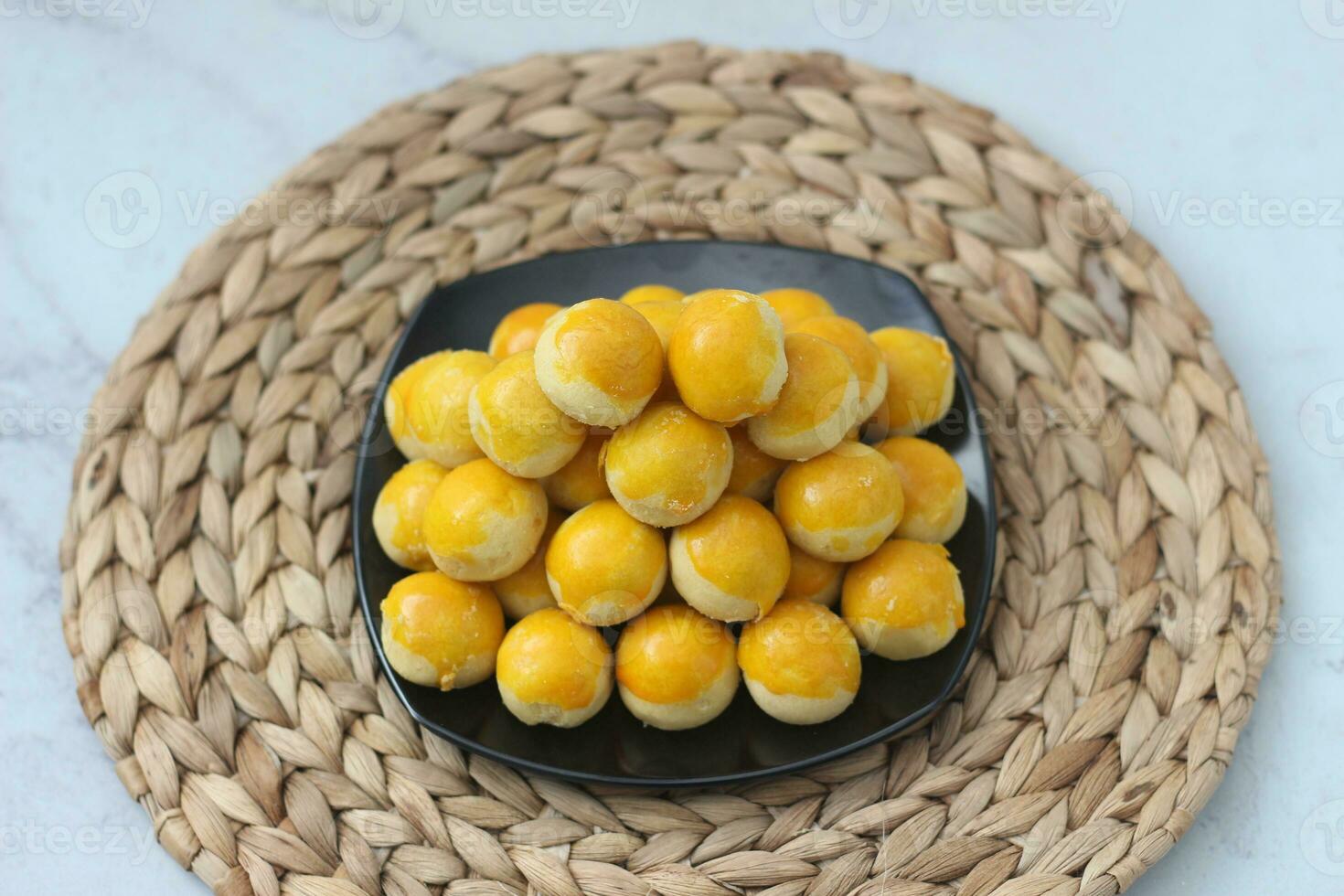 nastar cookies, pineapple tarts or nanas tart are small, bite-size pastries photo