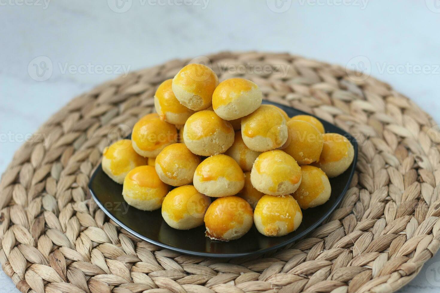 nastar cookies, pineapple tarts or nanas tart are small, bite-size pastries photo