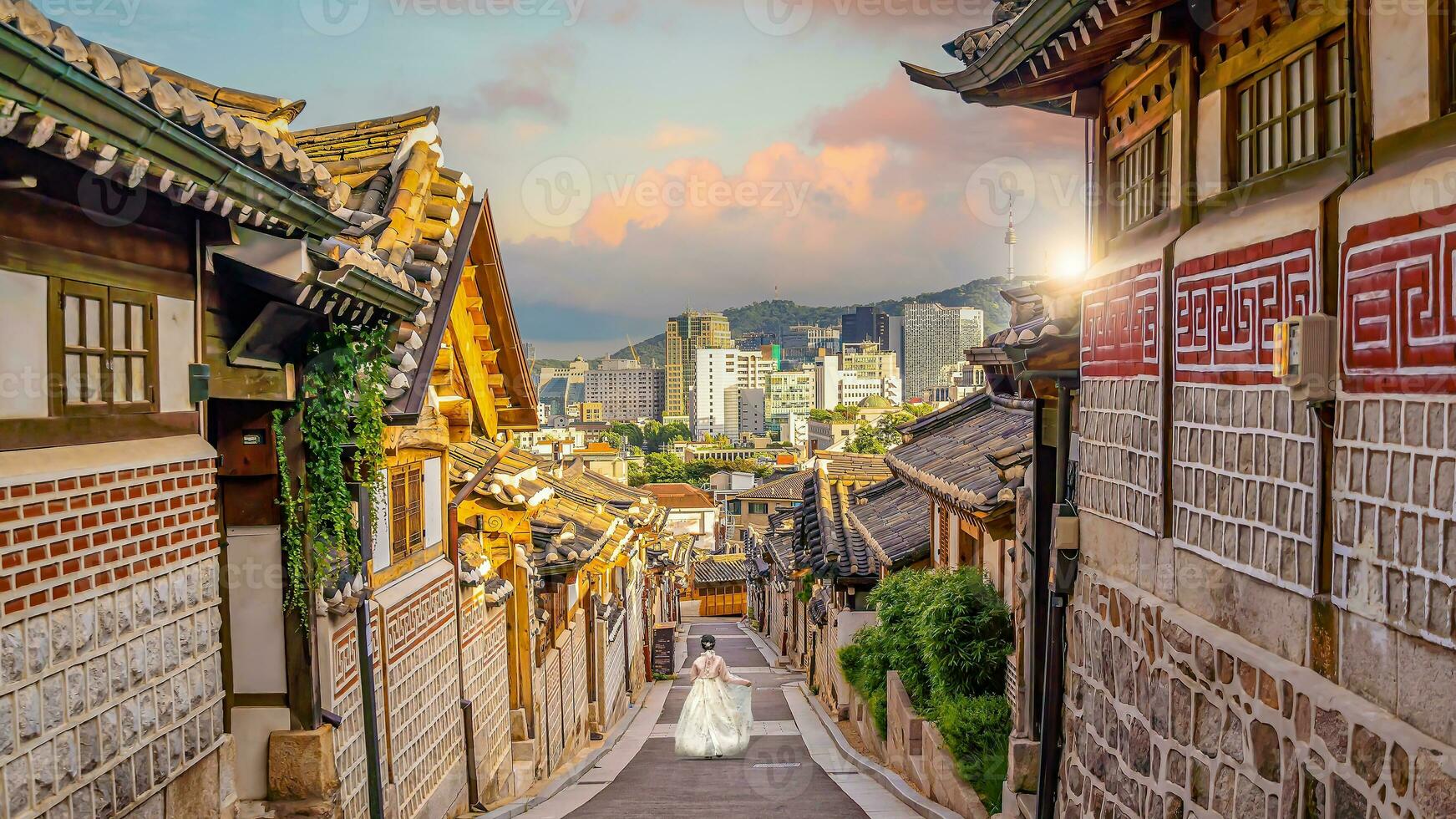 Bukchon Hanok Village with Seoul city skyline, cityscape of South Korea photo