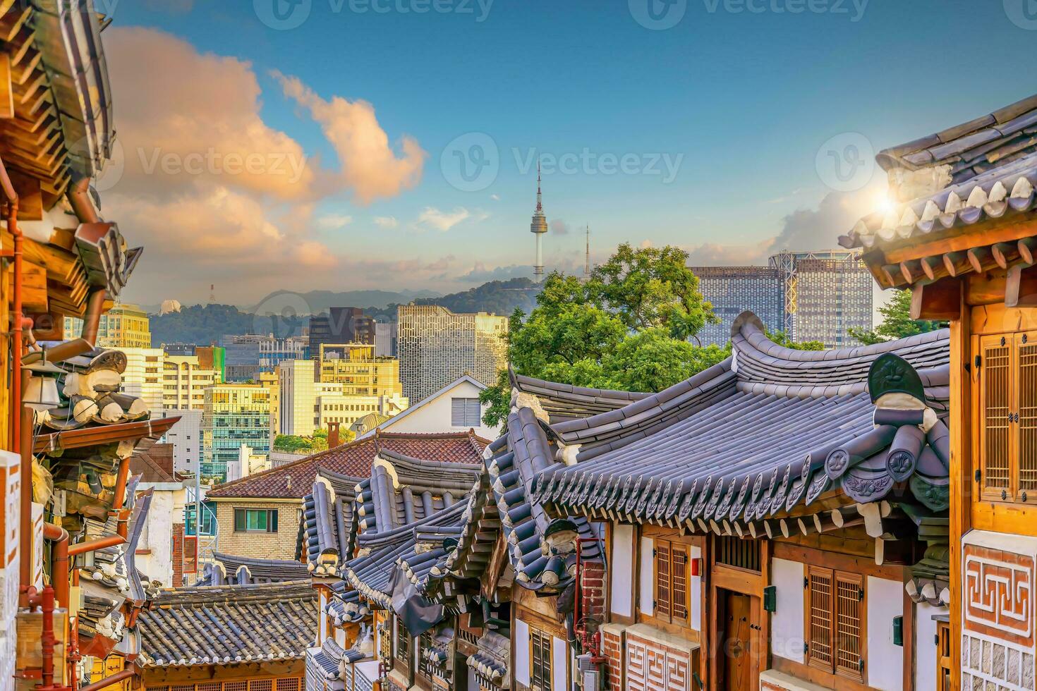 Bukchon Hanok Village with Seoul city skyline, cityscape of South Korea photo