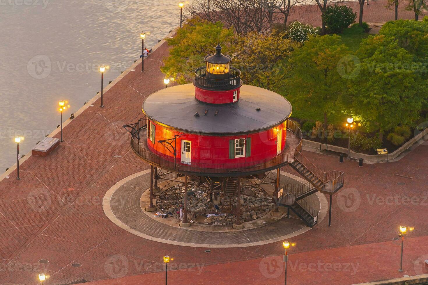 Red lighthouse at night, the Inner Harbor in Baltimore, Maryland photo