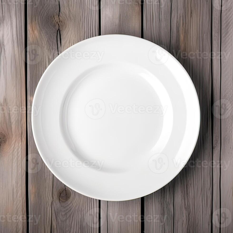 An empty plate on a white wooden table. Top view of white ceramic plate on white wooden. . photo