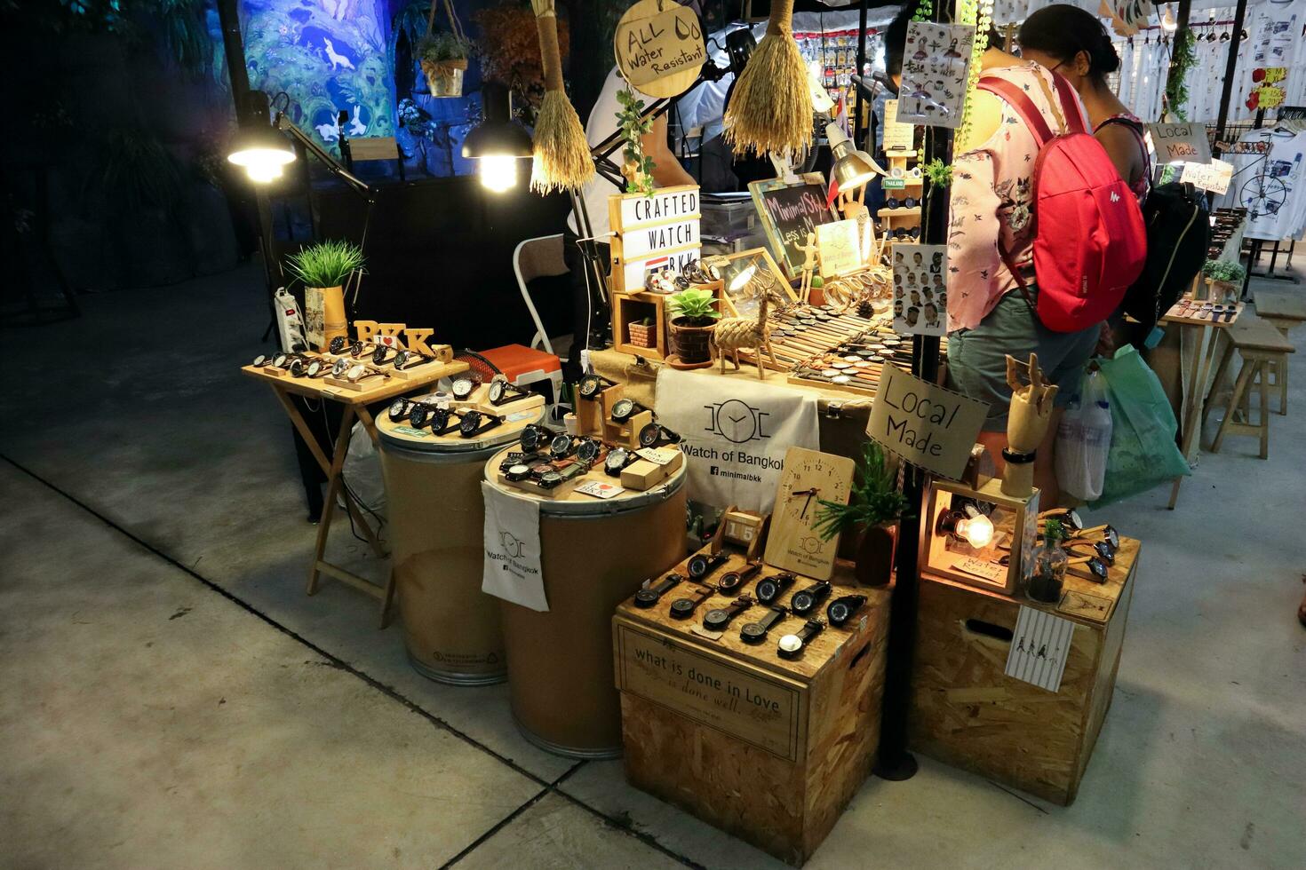 BANGKOK - June 15, 2018 local crafted watch and souvenir stall at night market in Pathum Wan district, ideal for artisan handicraft items. From cloths and watches to dry fruit photo