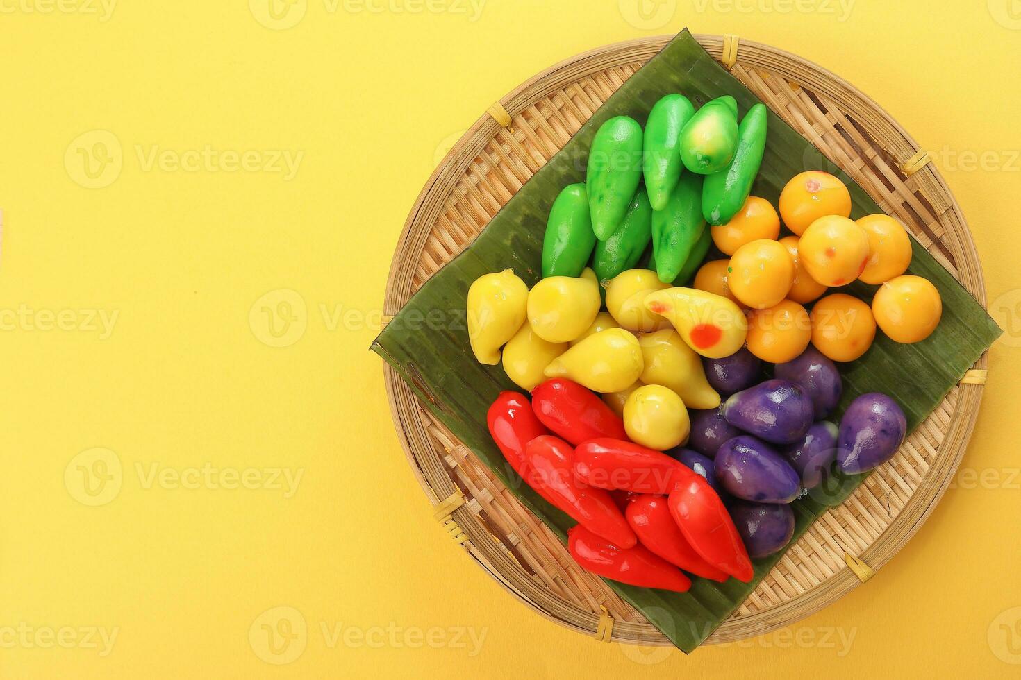 Colourful Luk chup look choop tadeonal Thai desert sweets candy creatve variety bamboo plate banana leaf photo