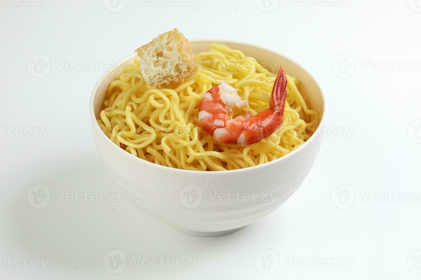 Fresh yellow egg noodle prawn tofu in bowl on whit background photo