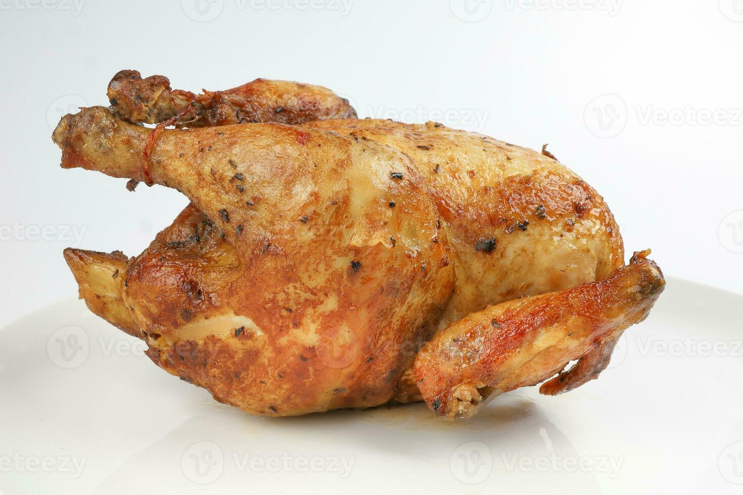 Whole roasted grilled chicken poultry bird on white background photo