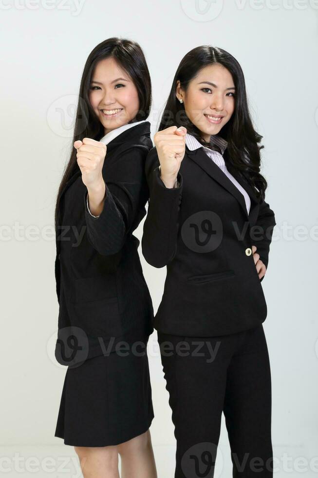 One young Asian Malaysian business office woman holding blank copy text space sign board on white background photo