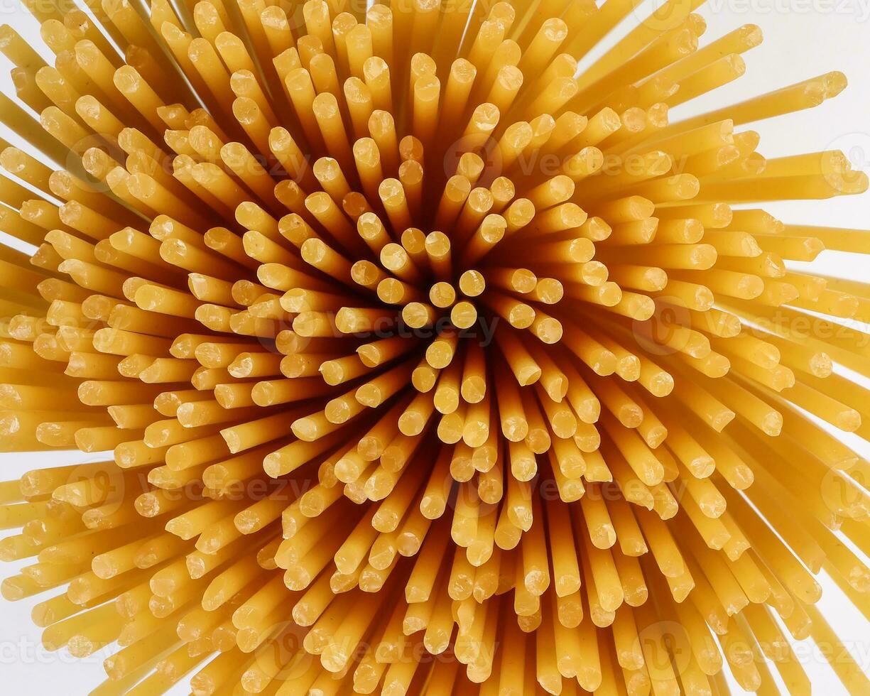 dry raw spaghetti white background blooming flower sunray glow pattern concept macro closeup photo