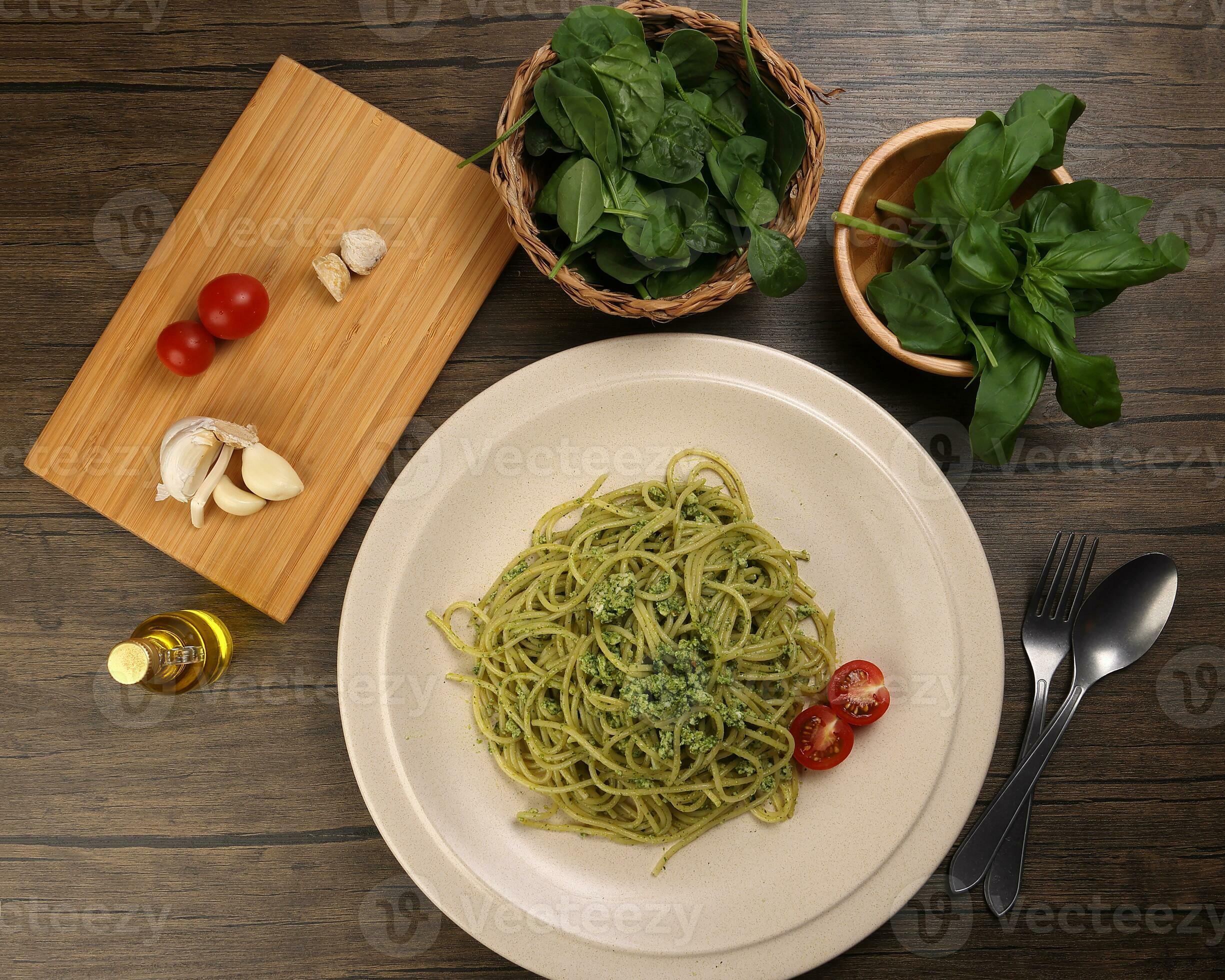 Asian style spaghetti with minced chicken spinach thai basil tomato
