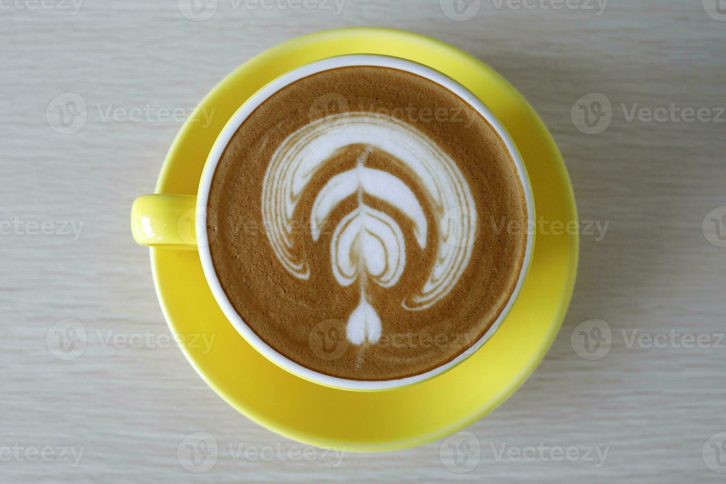Coffee Latte blue yellow cup on wooden table daylight copy space photo