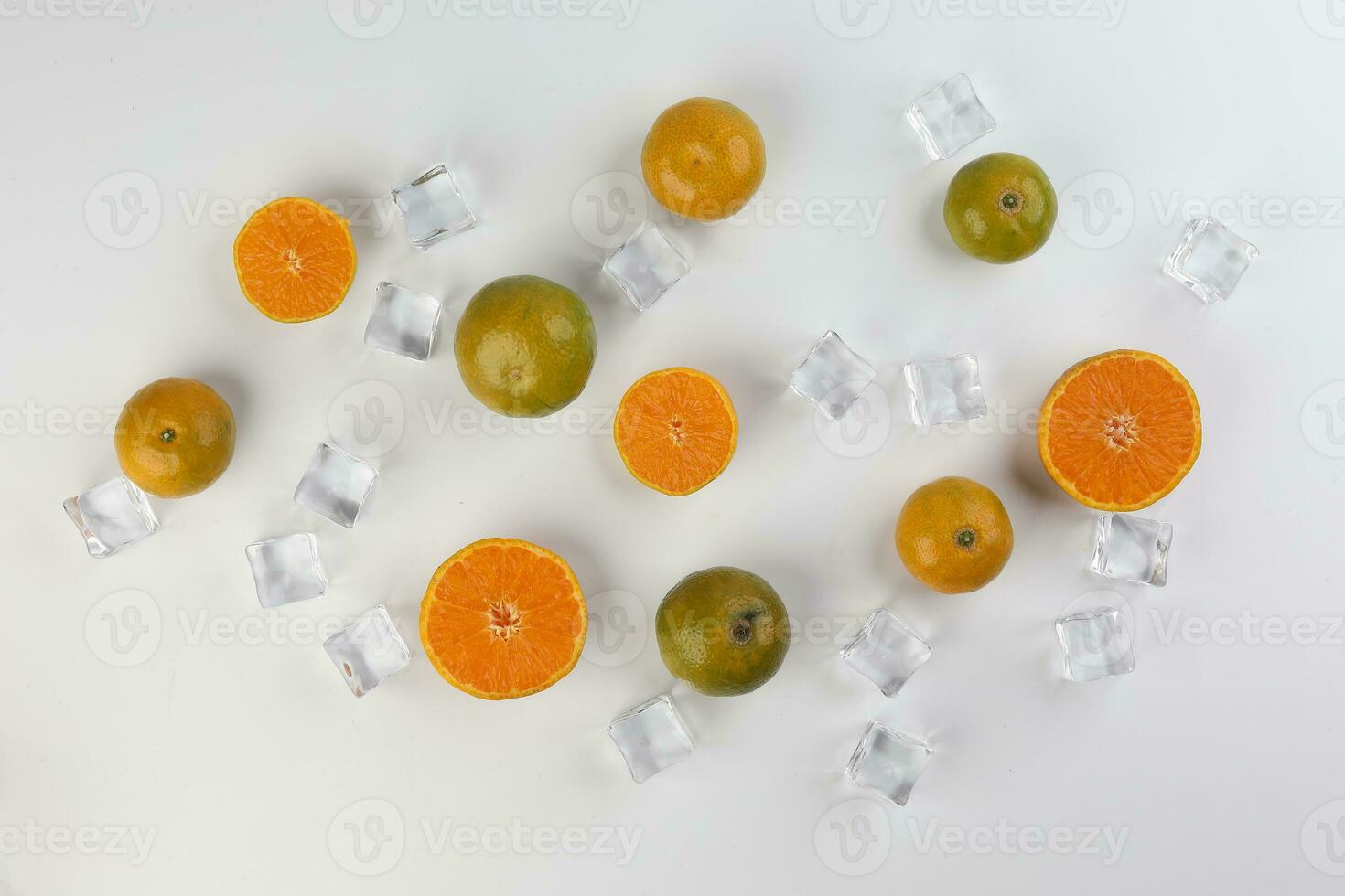 small yellow green mandarin ice cube orange whole slice on white background copy space for text photo