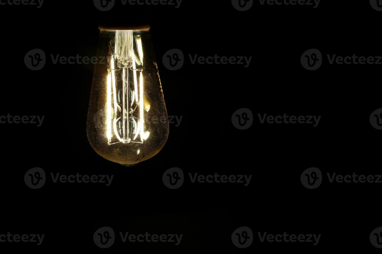 Light bulb tungsten LED on off flicker on black background photo