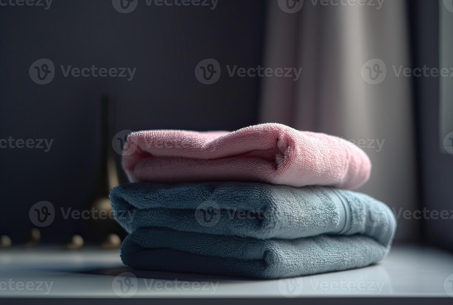 Stack of towels with a soap dispenser in a bathroom closeup. . photo