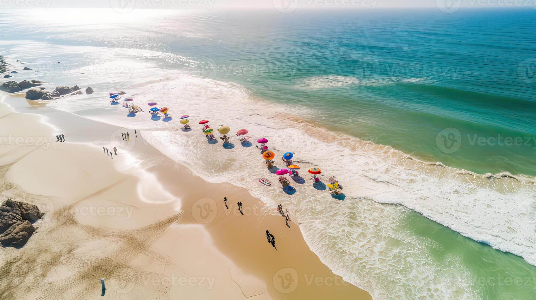 parte superior ver de arenoso playa con turquesa mar agua y vistoso azul sombrillas, aéreo zumbido disparo. generativo ai. foto