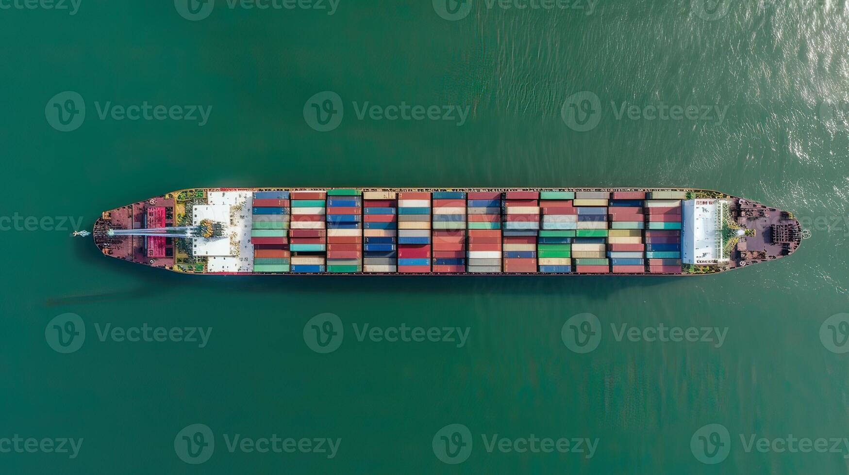 Aerial top view of cargo maritime ship with contrail in the ocean ship carrying container and running for export concept technology freight shipping by ship forwarder mast. . photo