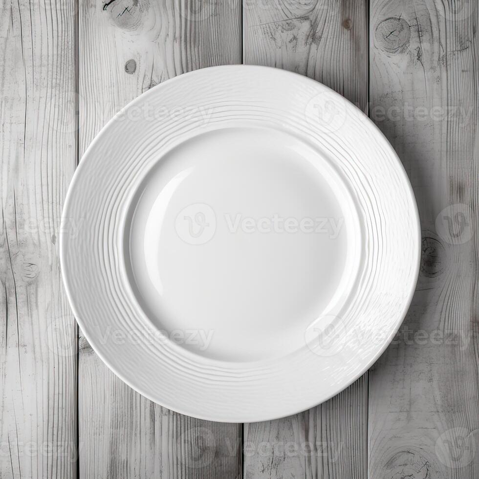 An empty plate on a white wooden table. Top view of white ceramic plate on white wooden. . photo