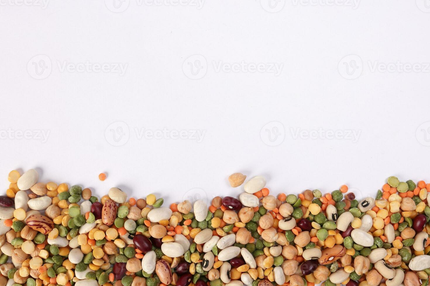 Mixed beans multi grain colorful mixture horizontal line frame border copy text space on white background photo
