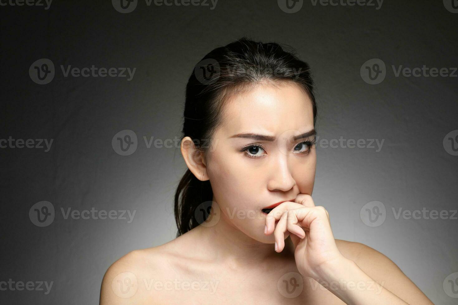 Young beautiful Asian woman facial expression photo