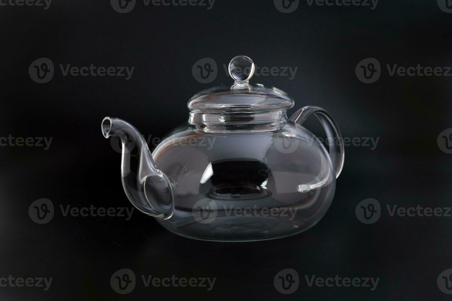 https://static.vecteezy.com/system/resources/previews/024/325/952/non_2x/empty-transparent-glass-see-through-teapot-kettle-on-black-background-photo.JPG