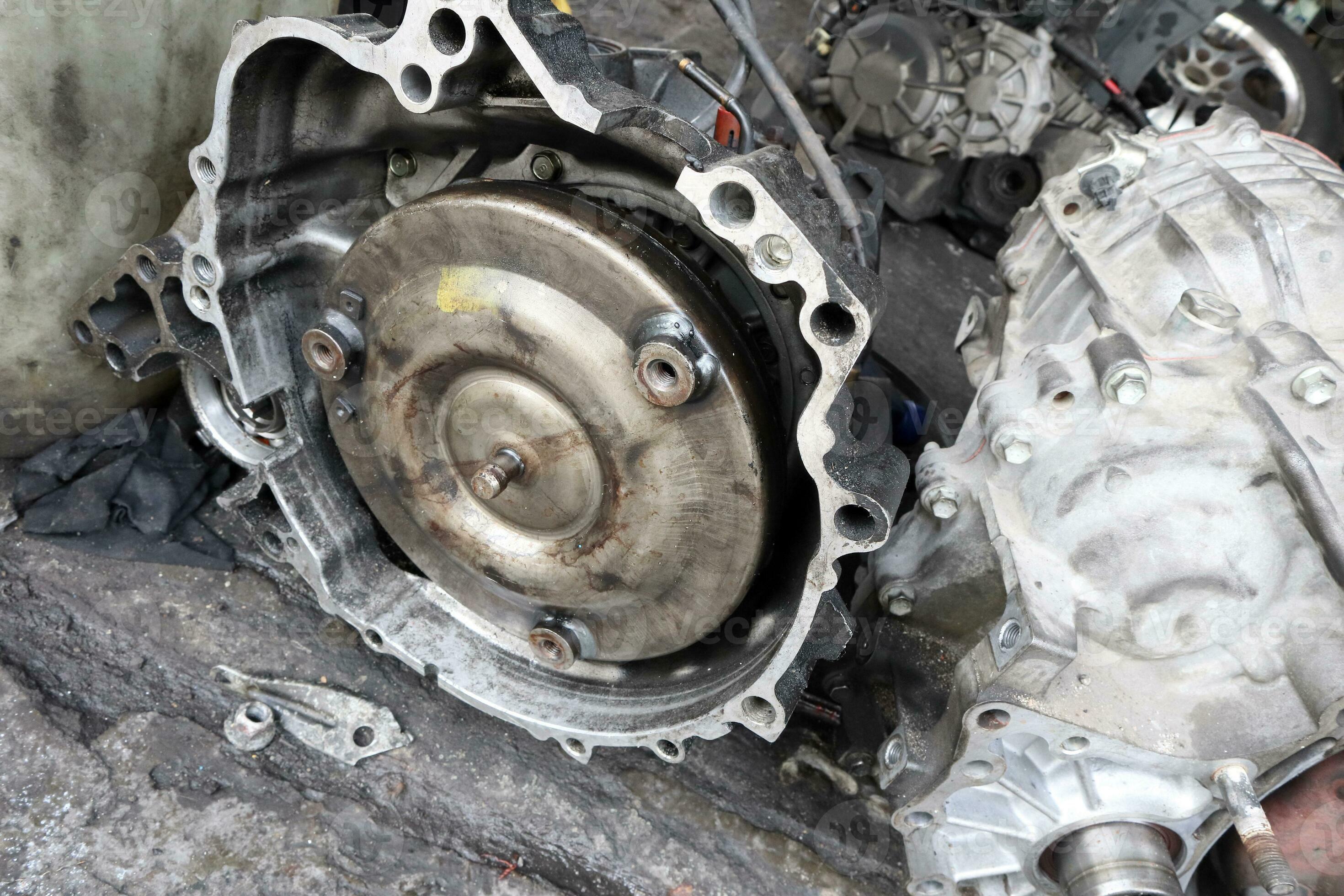Old dirty used broken Auto transmission gearbox on floor for