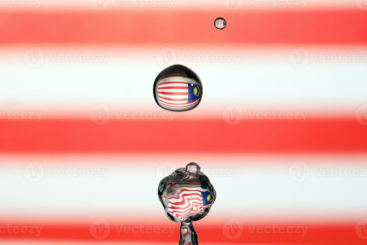 Water droplet drop splash collision dripping pillar Malaysia Flag reflection refraction independence country patriot photo