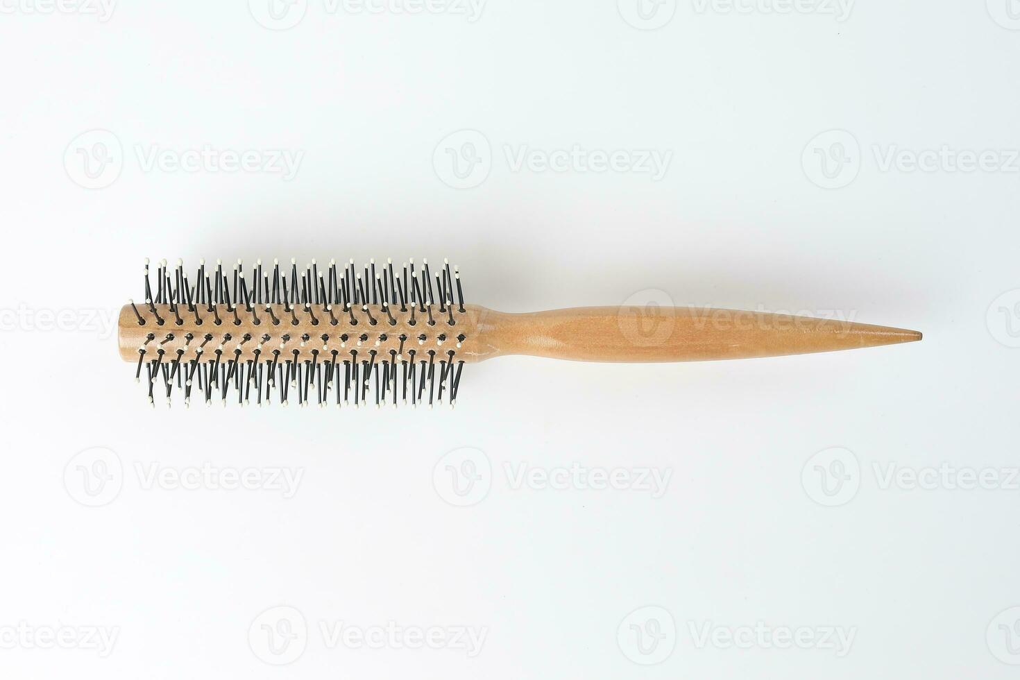 Round hair brush comb on white background photo