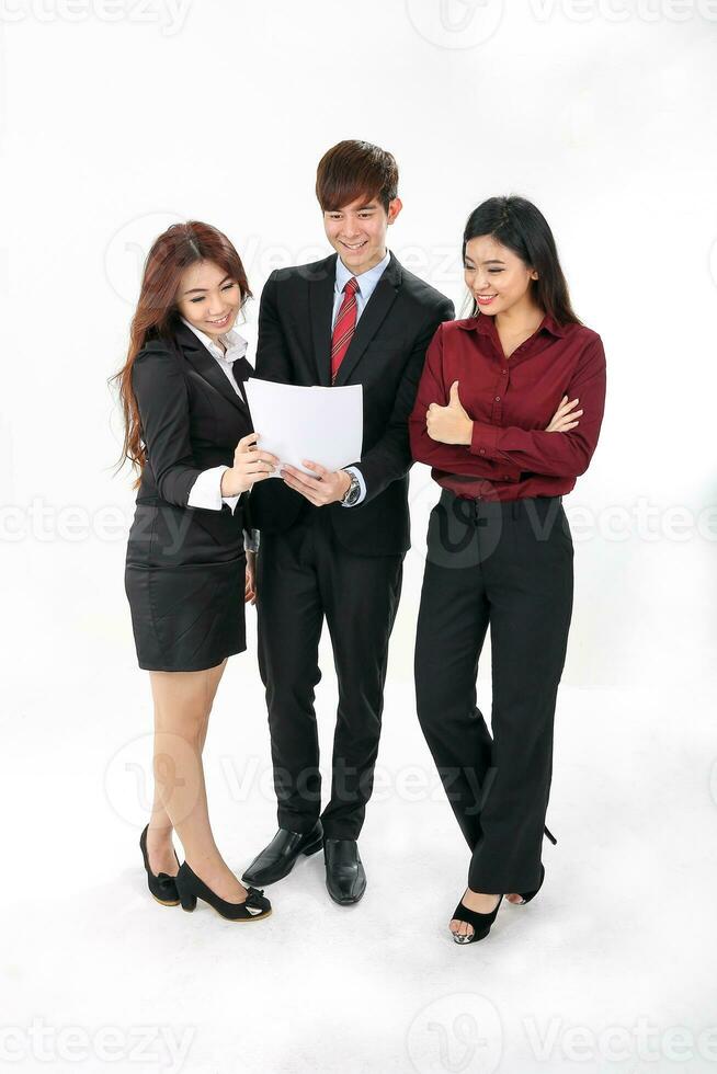 Young attractive one man two woman business office white background stand looking reading looking documents study point photo