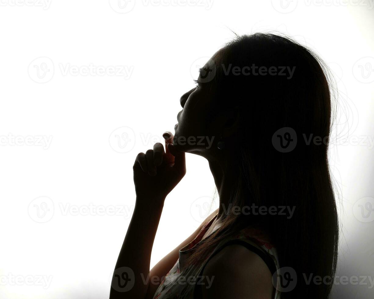 Silhouette dark black portraits of young southeast Asian woman on white background romance love care friends emotion expression thoughts photo